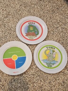 2 RAINFOREST CAFE Kids Character Plates and one kids food plate
